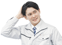 あごに手をついて、困っている様子の男性の写真